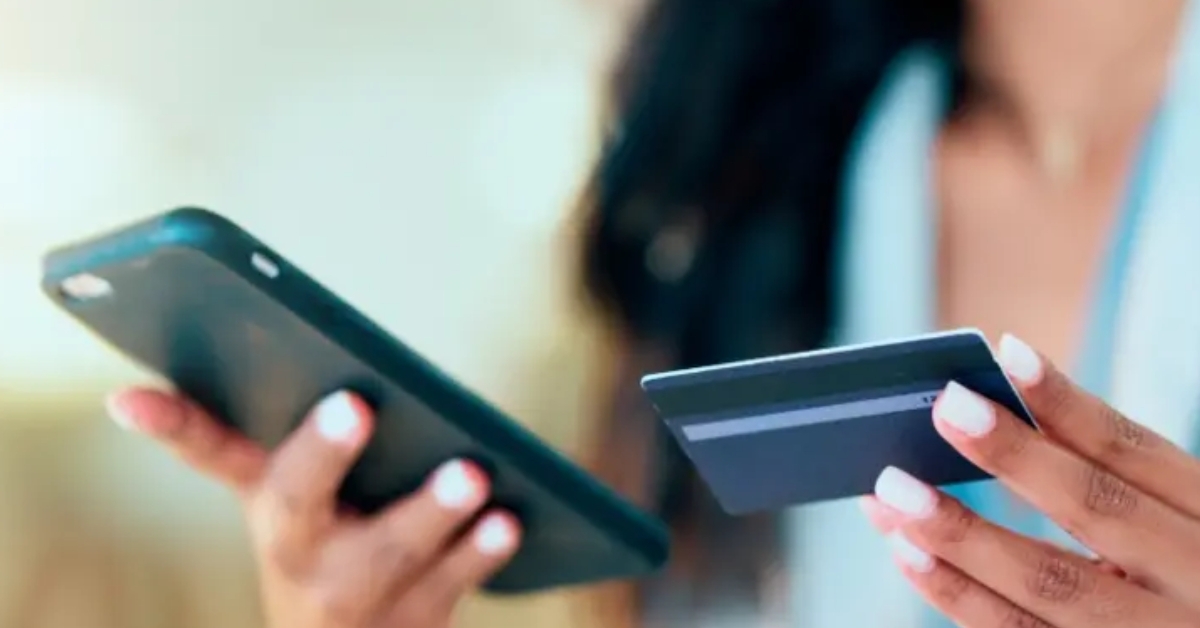 woman with credit card and cellpone