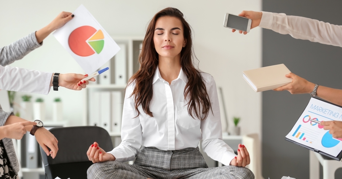 businesswoman meditating in office