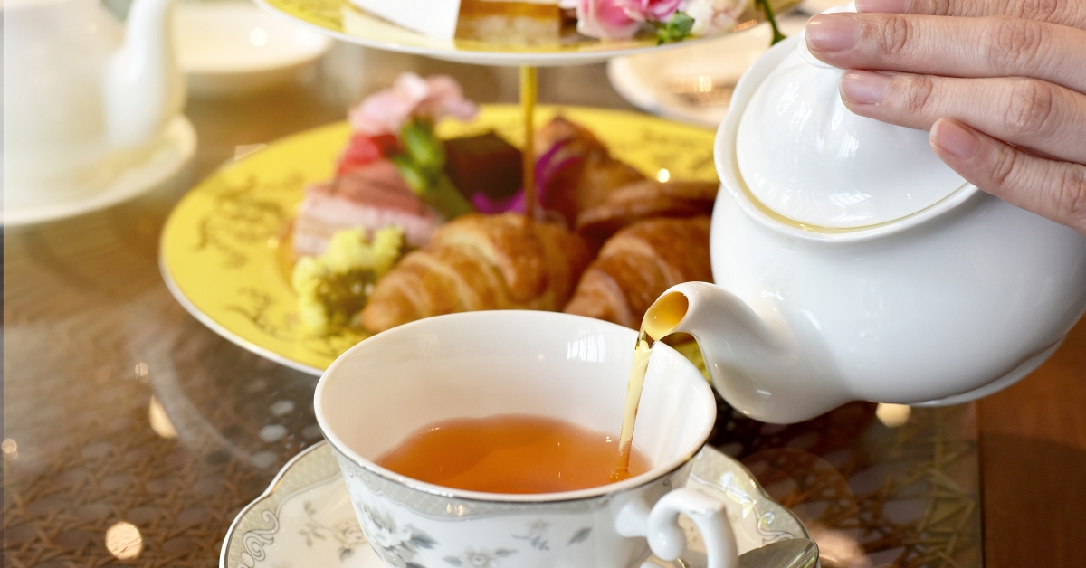 pouring tea from vintage teapot