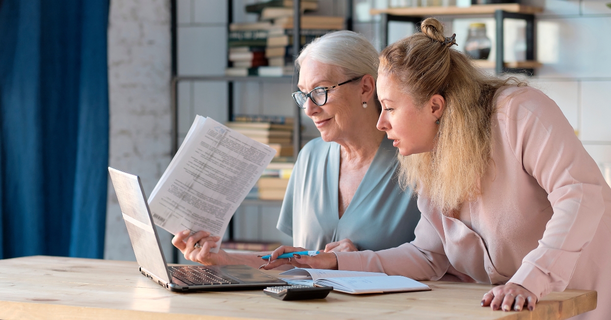 woman using laptop for websurfing in her kitchen