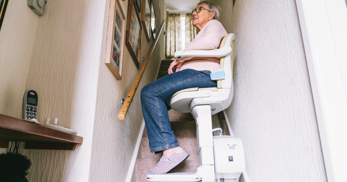 woman using automatic stair lift
