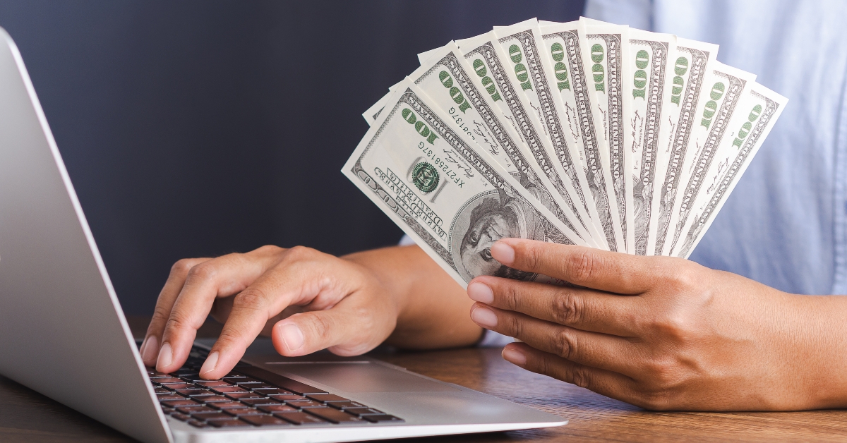 young man with dollar banknotes