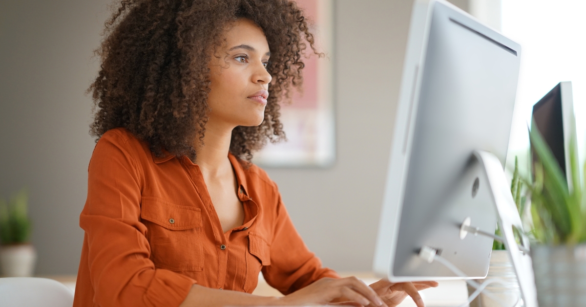 businesswoman working on desktop computer
