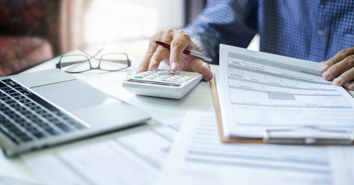 man calculating income from starting