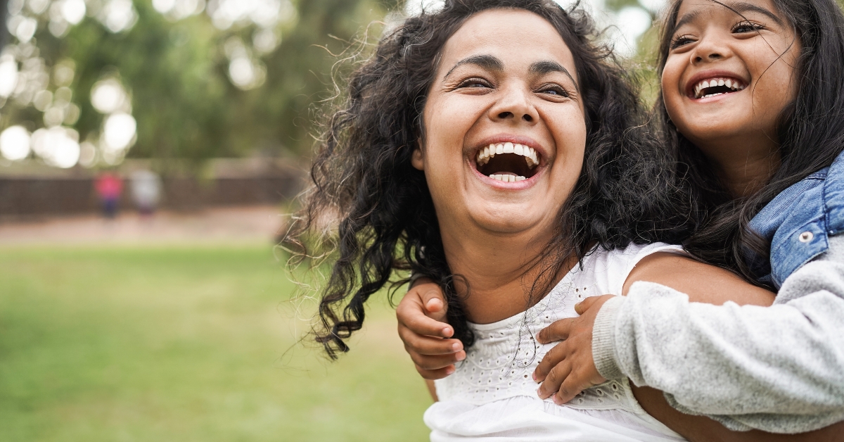mother having fun with her daughter outdoor