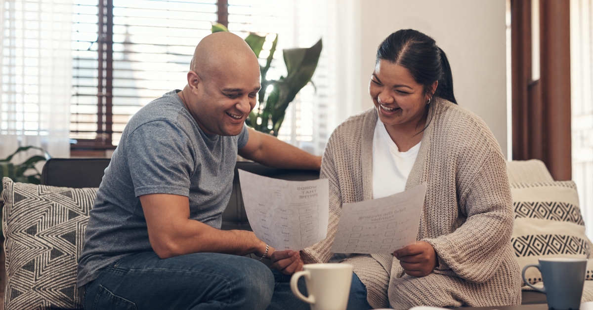 couple going over paperwork at home