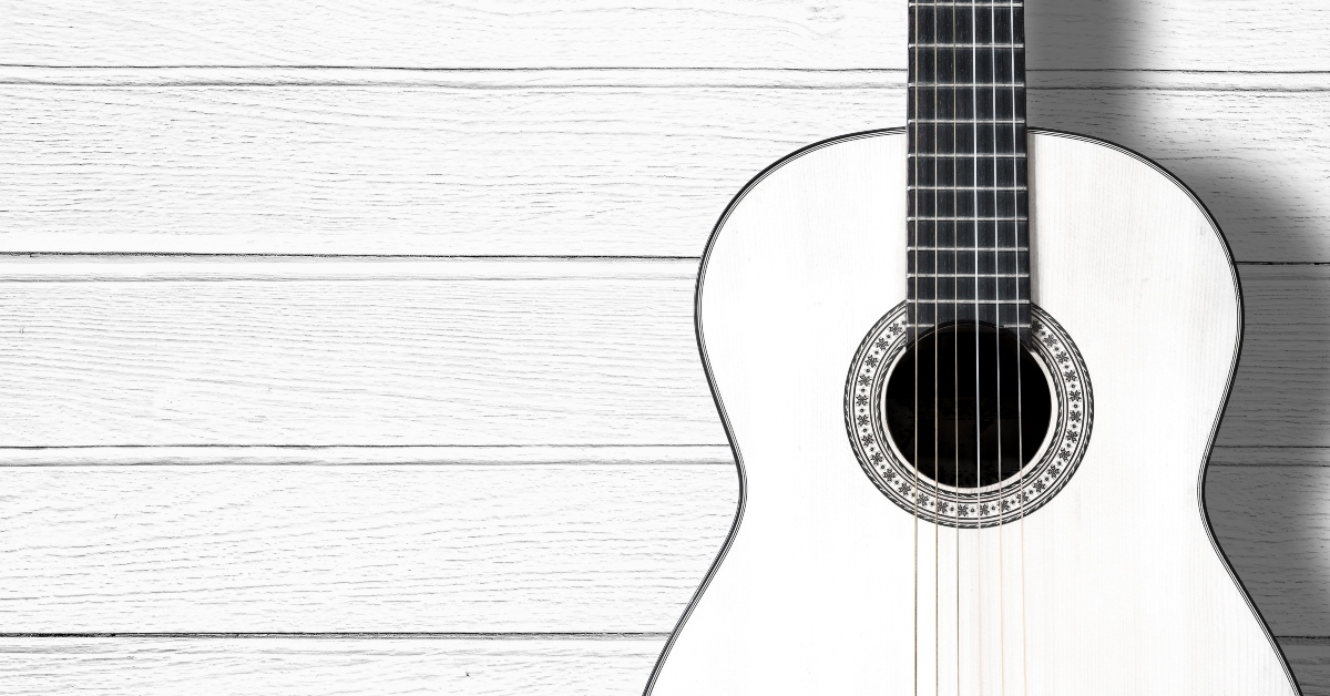 white wood acoustic guitar