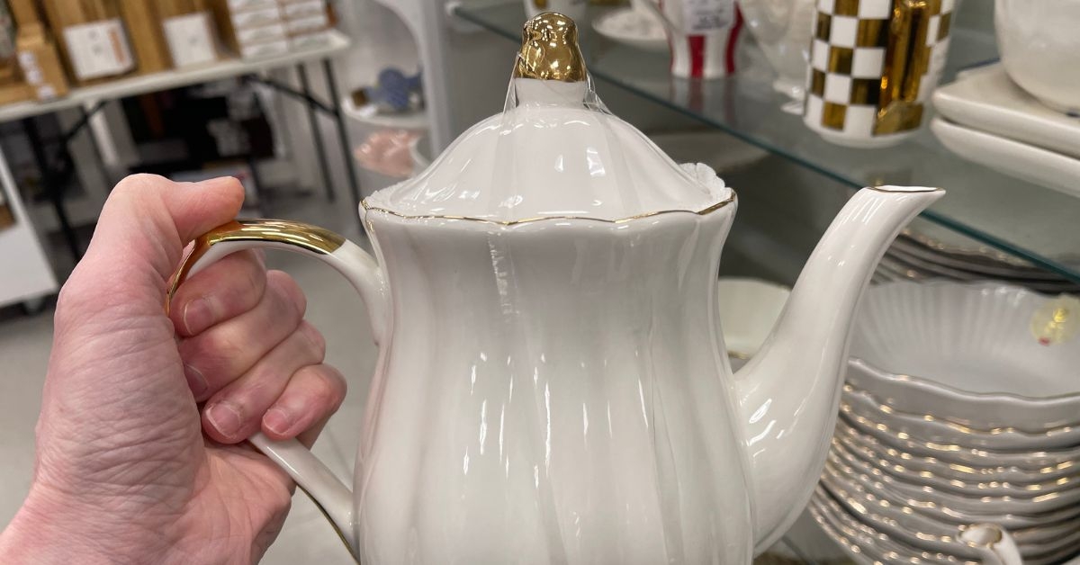 person holding a teapot