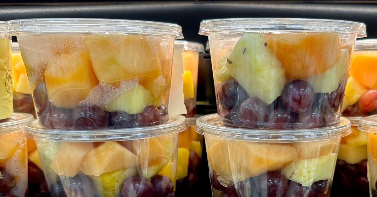 a pile of fresh fruit cups