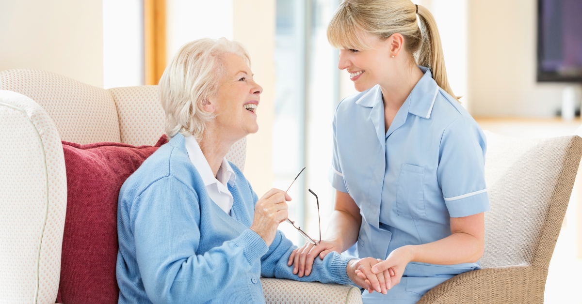Caregiver talking with older woman