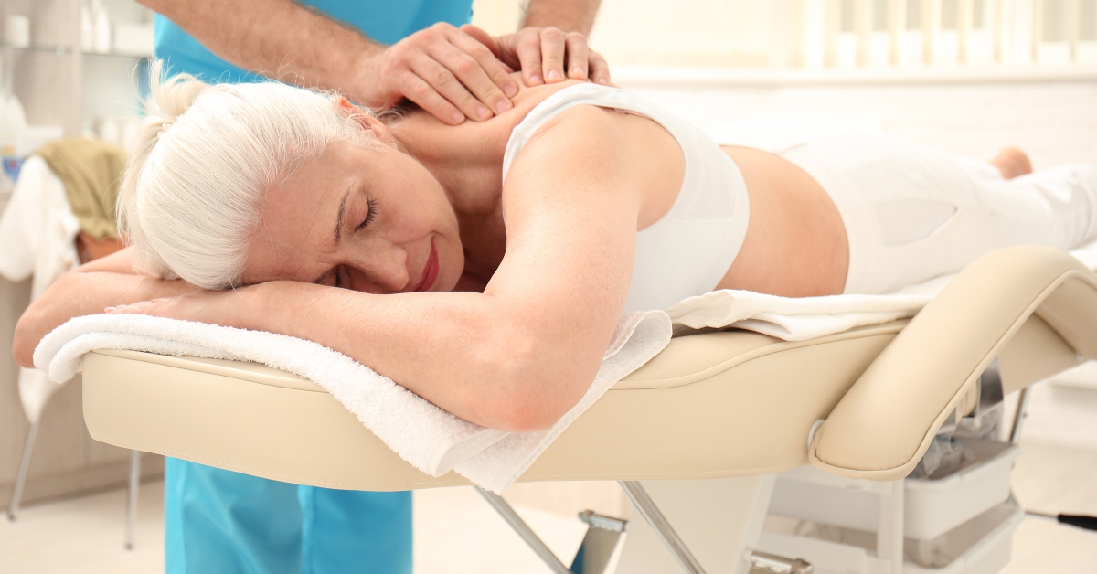 Elderly woman getting massage
