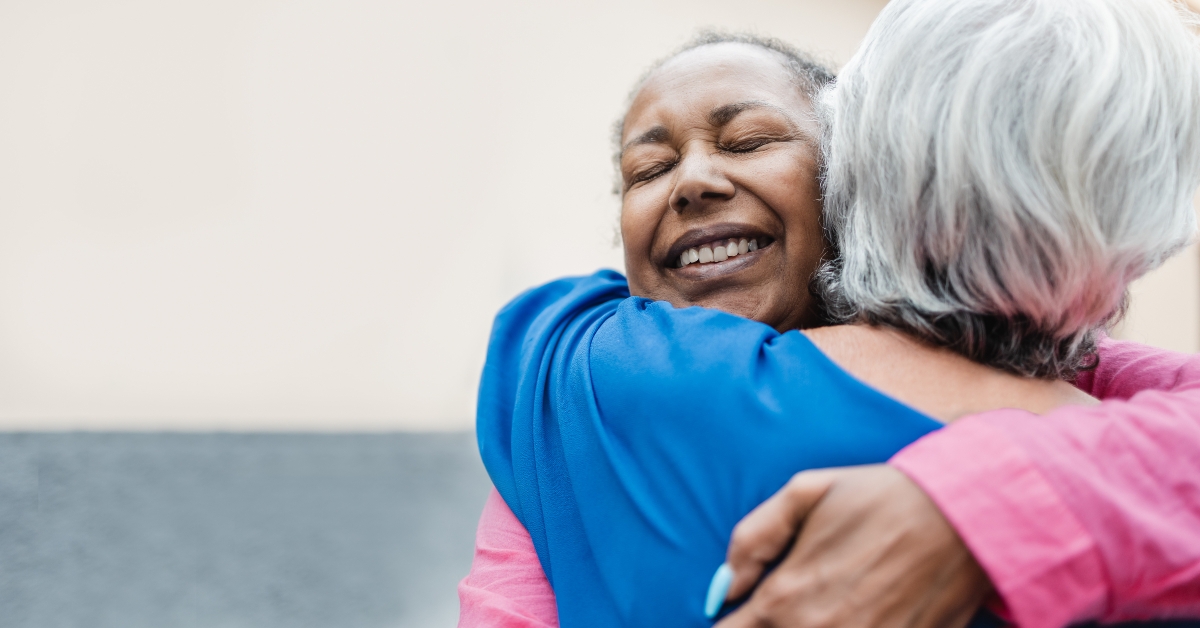 senior women hugging each other