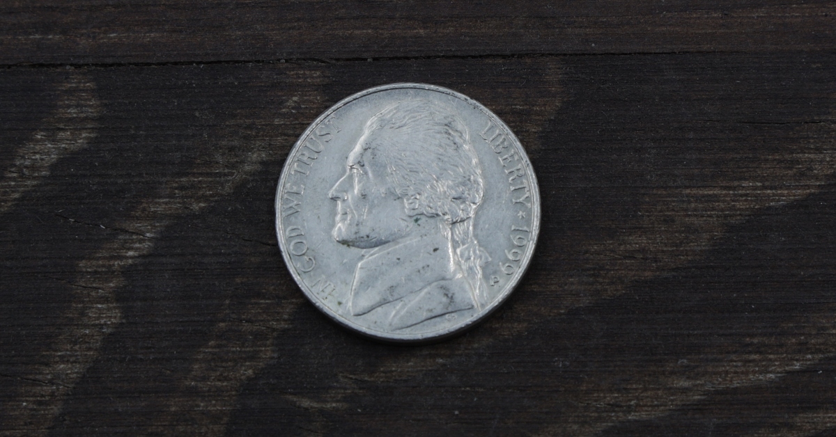 five cents on wooden table 