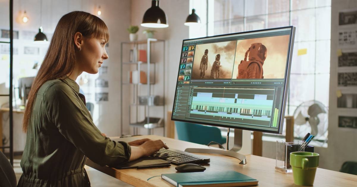 Female Video Editor Works with Footage in Work Office