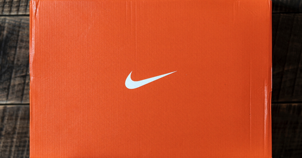 Orange Nike shoe box on wooden table