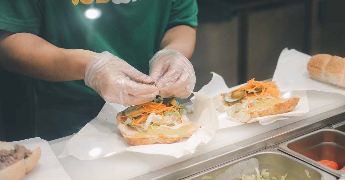cooking sandwich at subway restaurant 