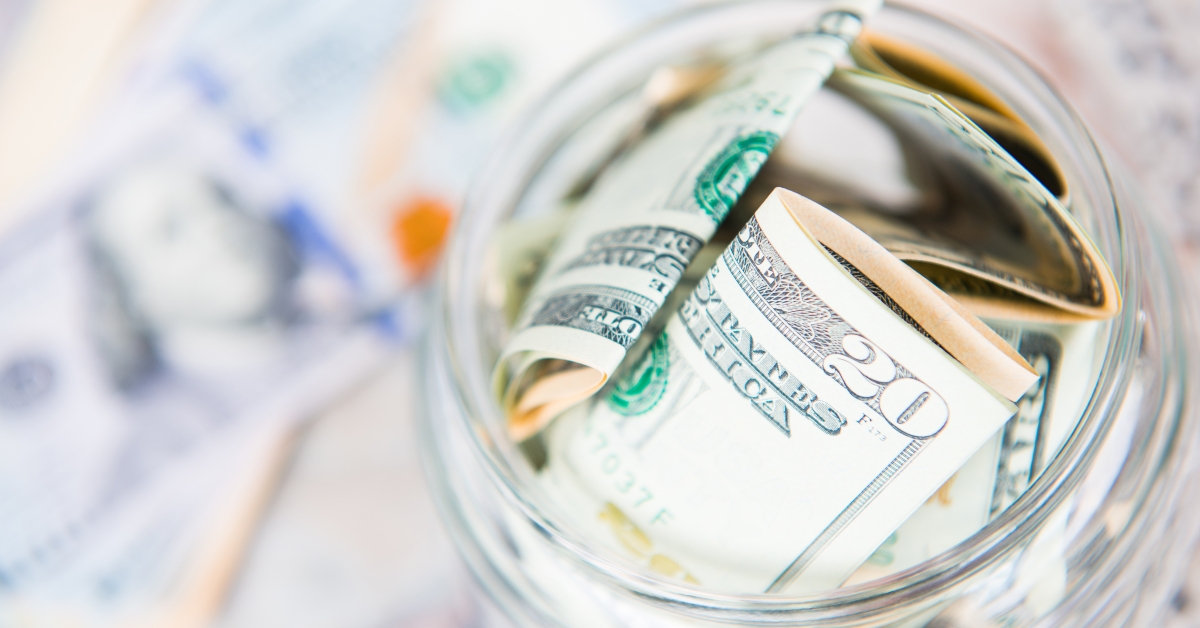 saving money in jar with American dollors