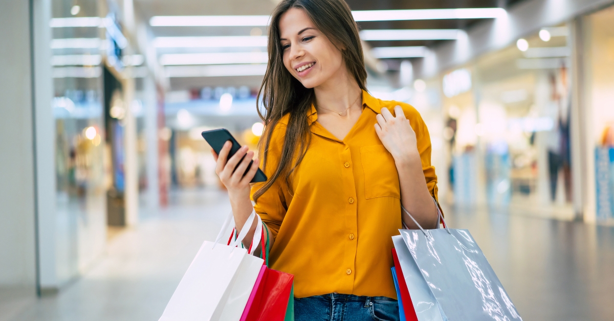 stylish woman with shopping bags