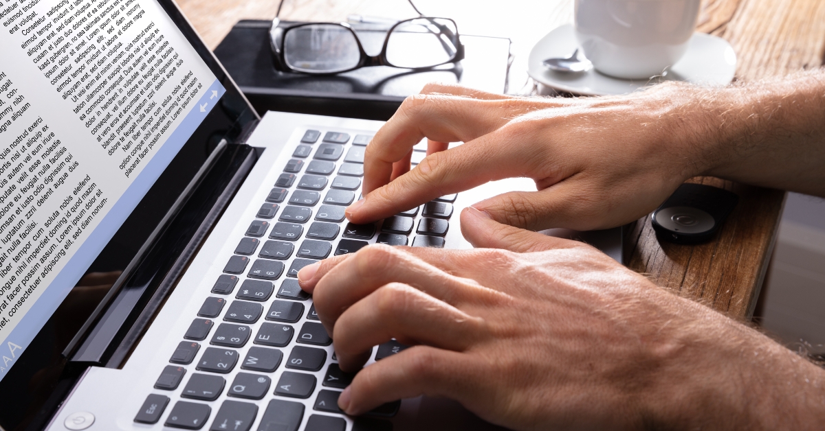 person typing on laptop 