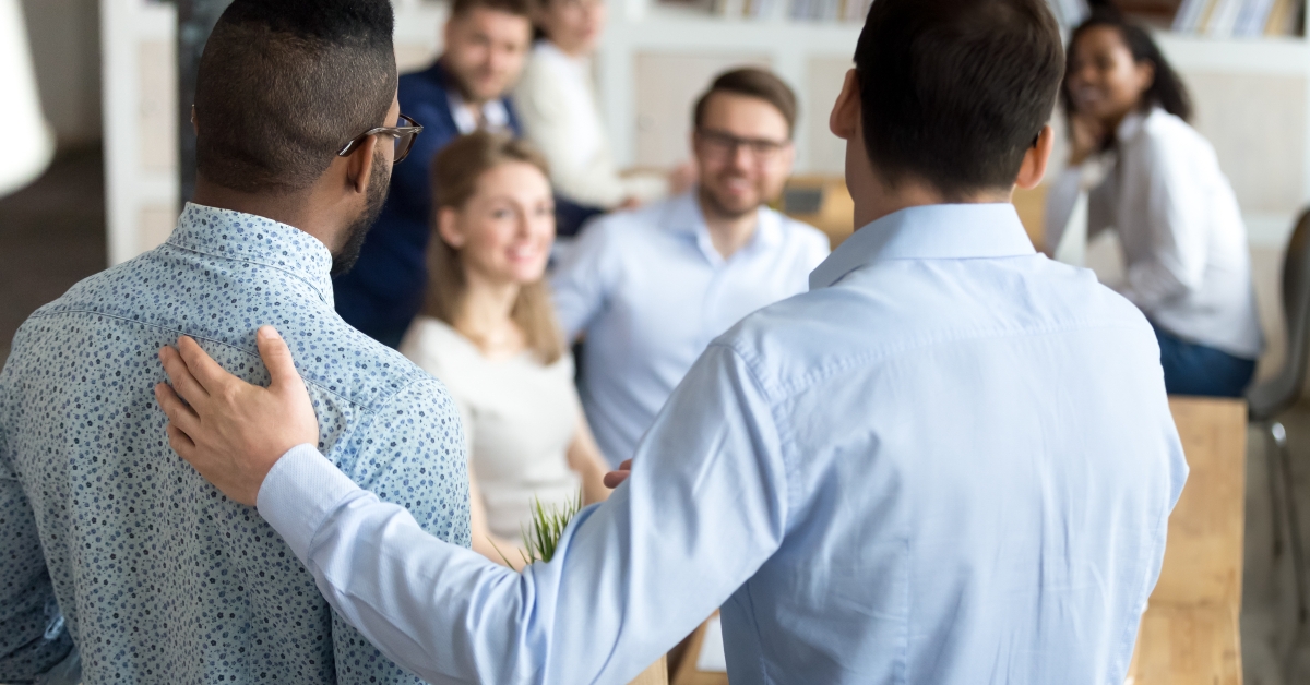 boss introducing new worker to workmates 