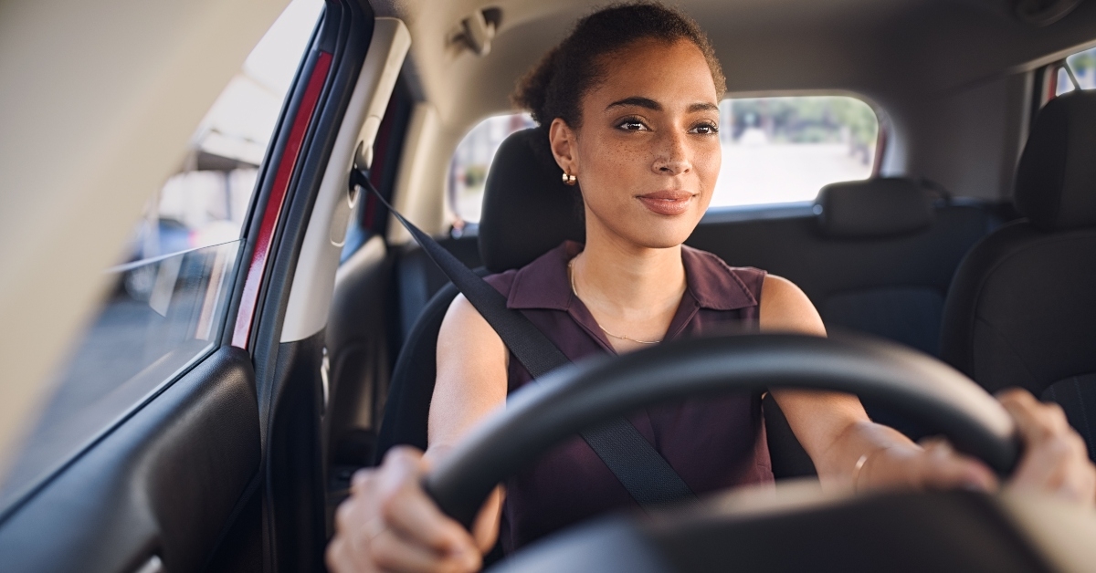 young woman driving car