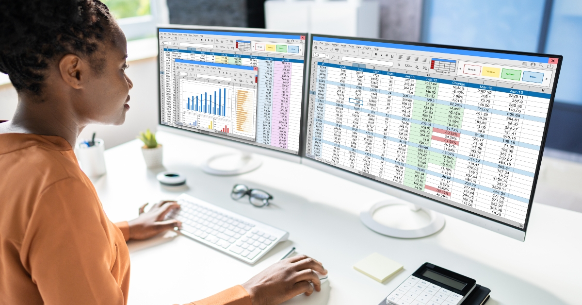 data analyst african woman using spreadsheet 