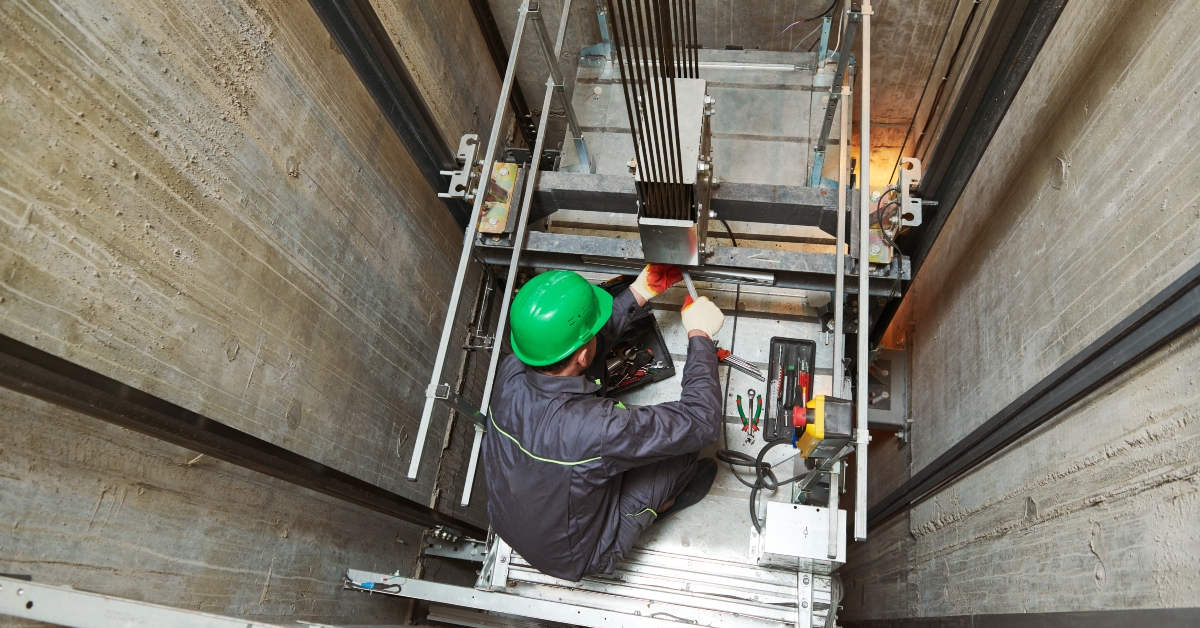 machinist repairing elevator