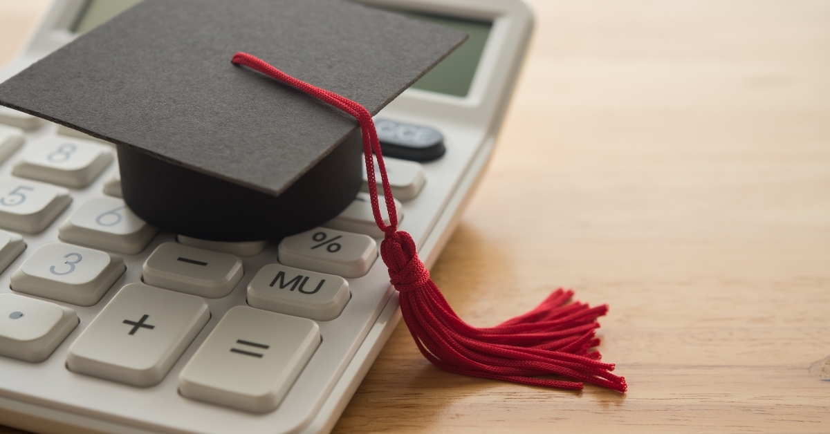 mortarboard on white calculator