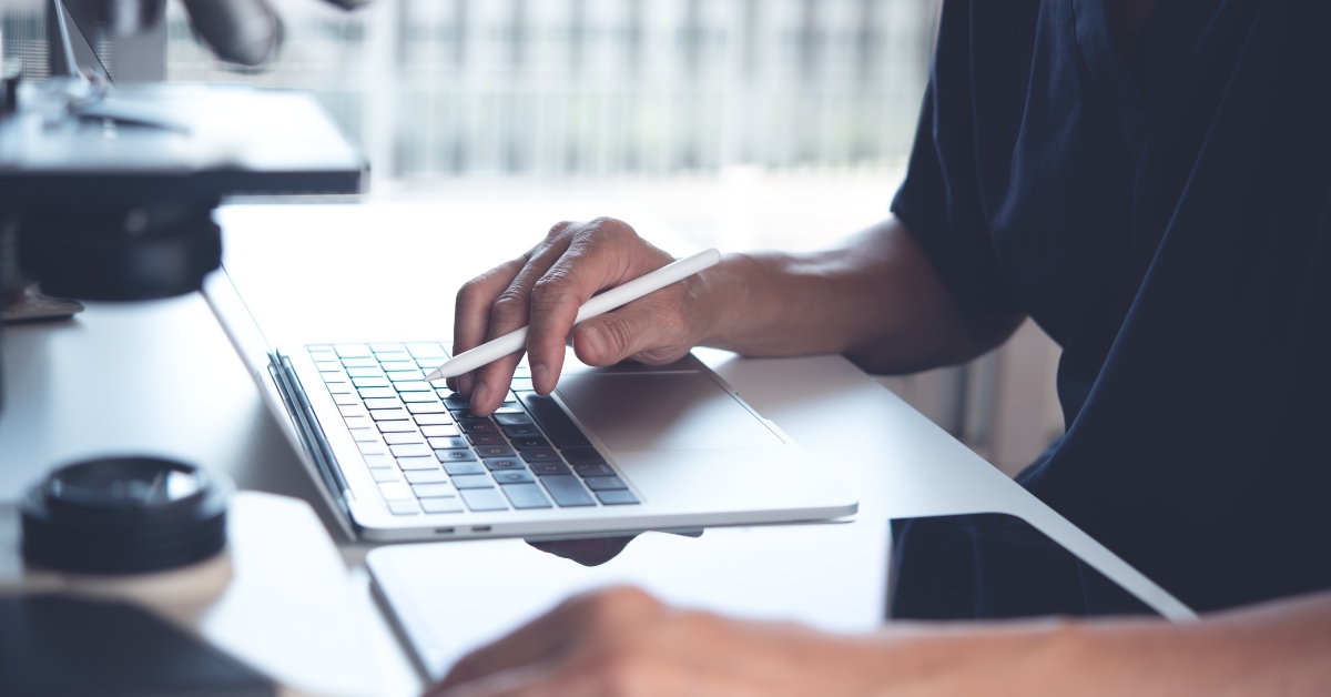 scientist working on laptop