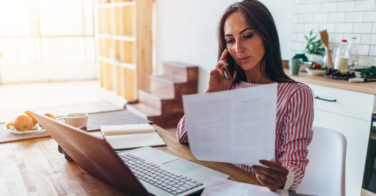 talking on mobile phone in kitchen 