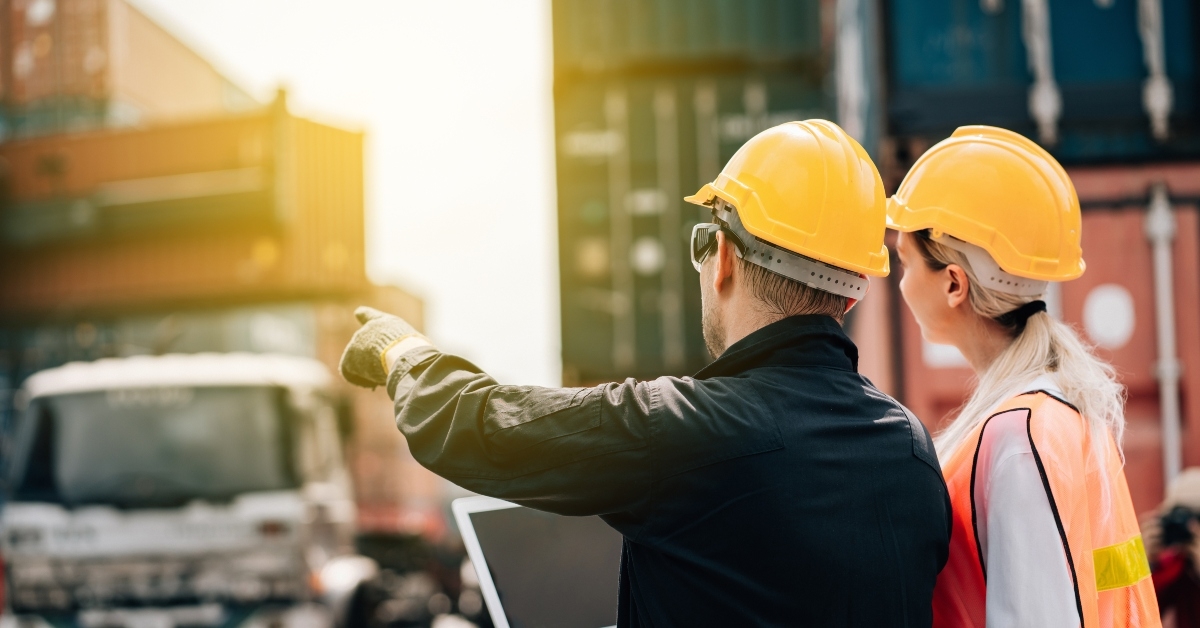 workers teamwork man and woman in safety jumpsuit