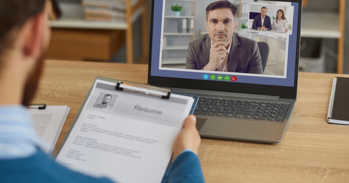 business personnel recruiter listening to male candidate in virtual online job interview