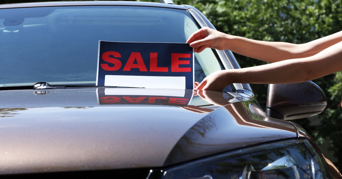 For sale sign on windshield of car