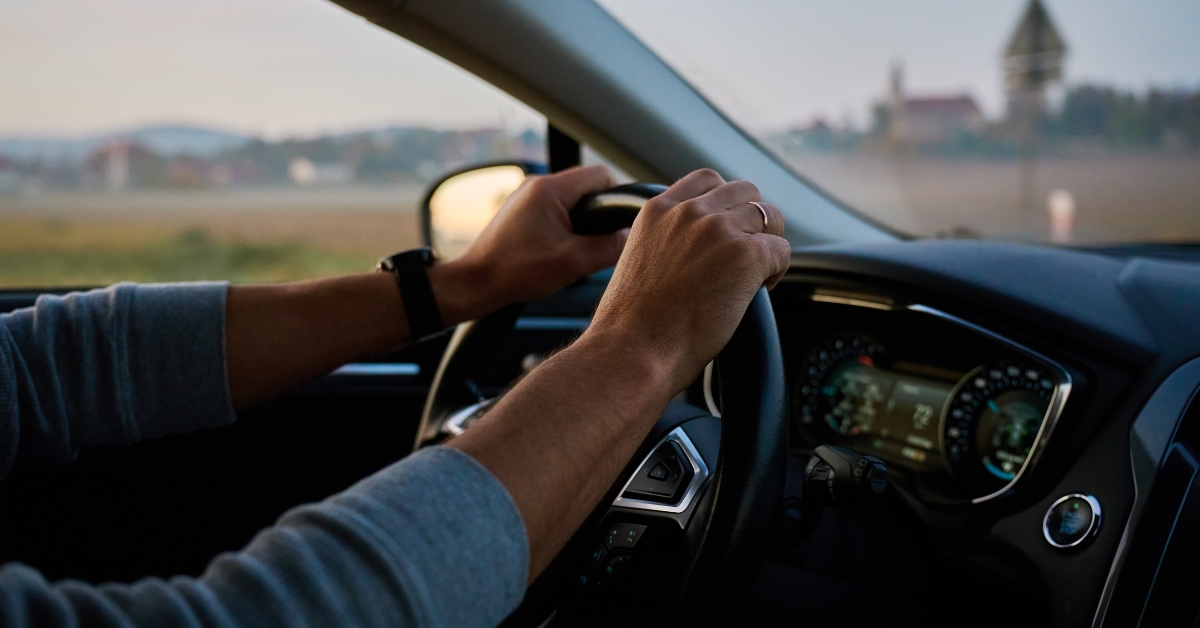 Male driver driving car