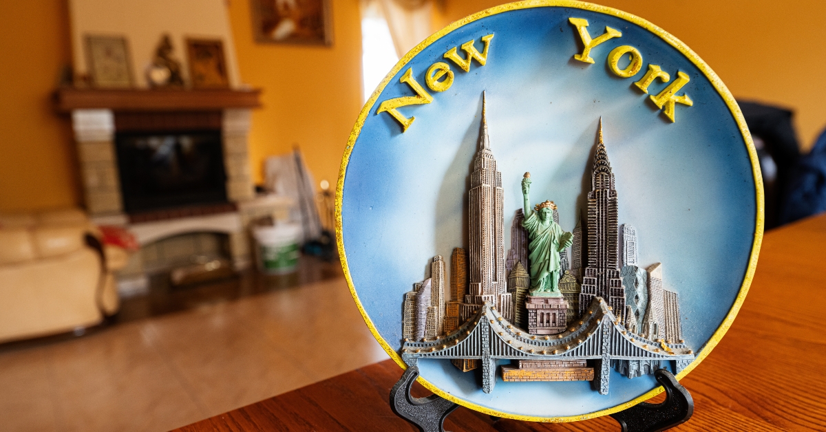 New York souvenir plate on a stand at home