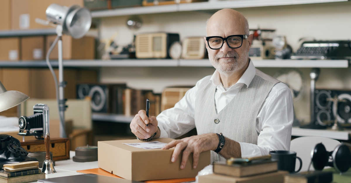 Seller writing the address on a delivery box 