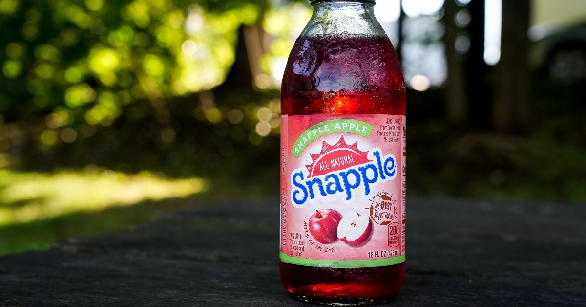 Snapple apple glass bottle on table 