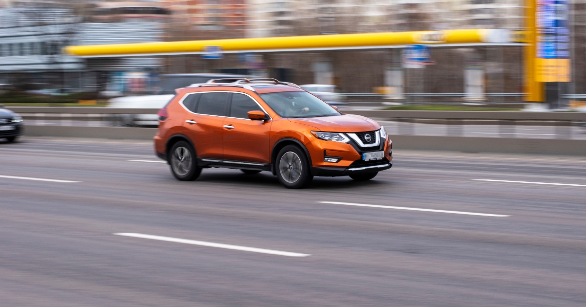 orange nissan rogue car