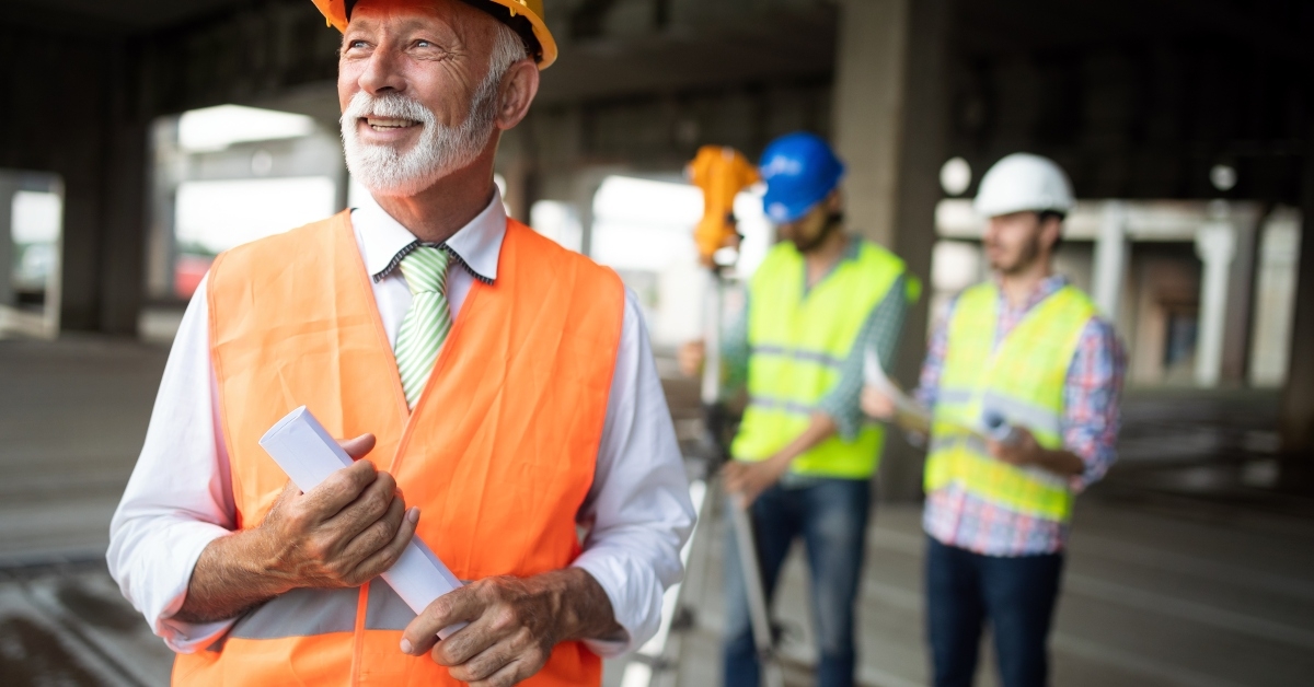 businessman in hardhat on building site