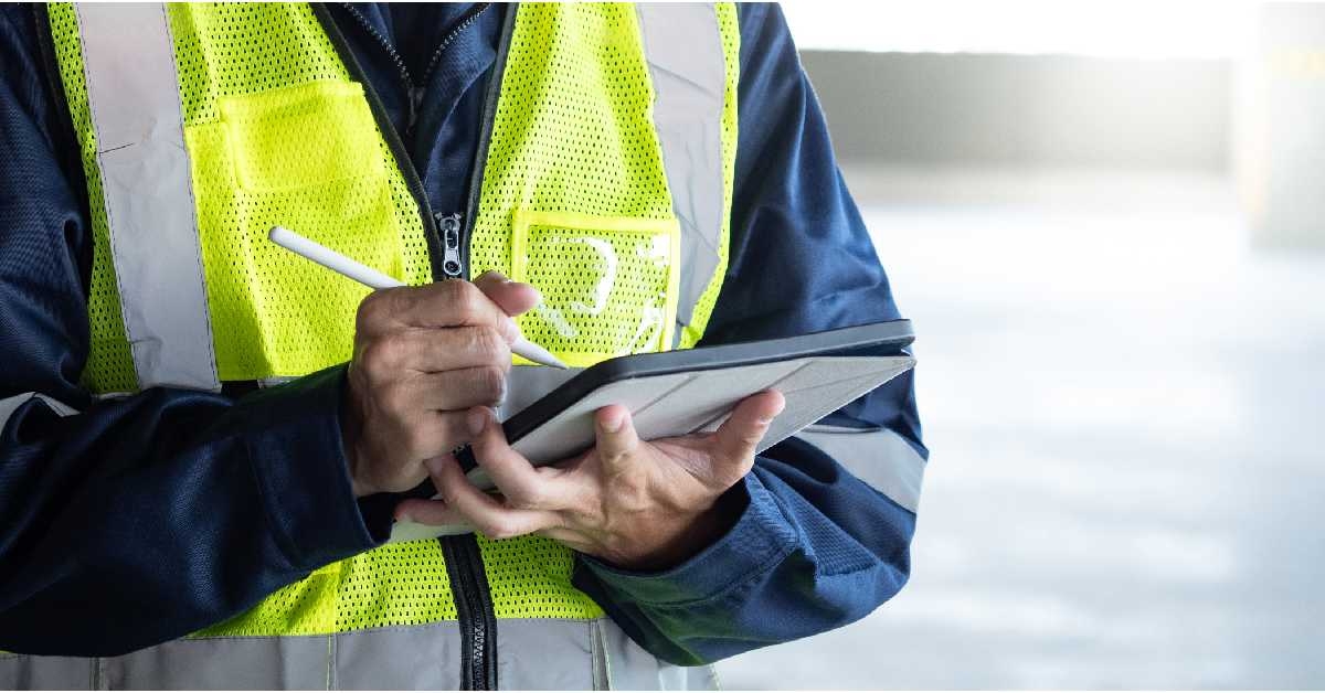 man using digital tablet checking safety
