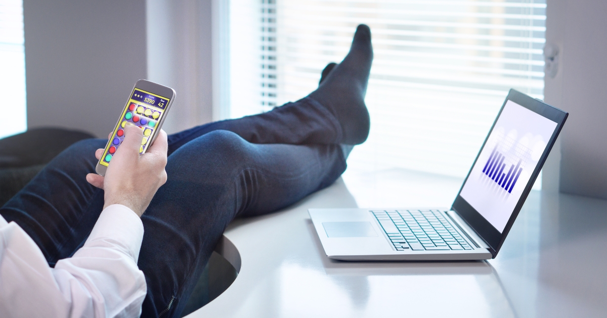 office worker playing mobile game