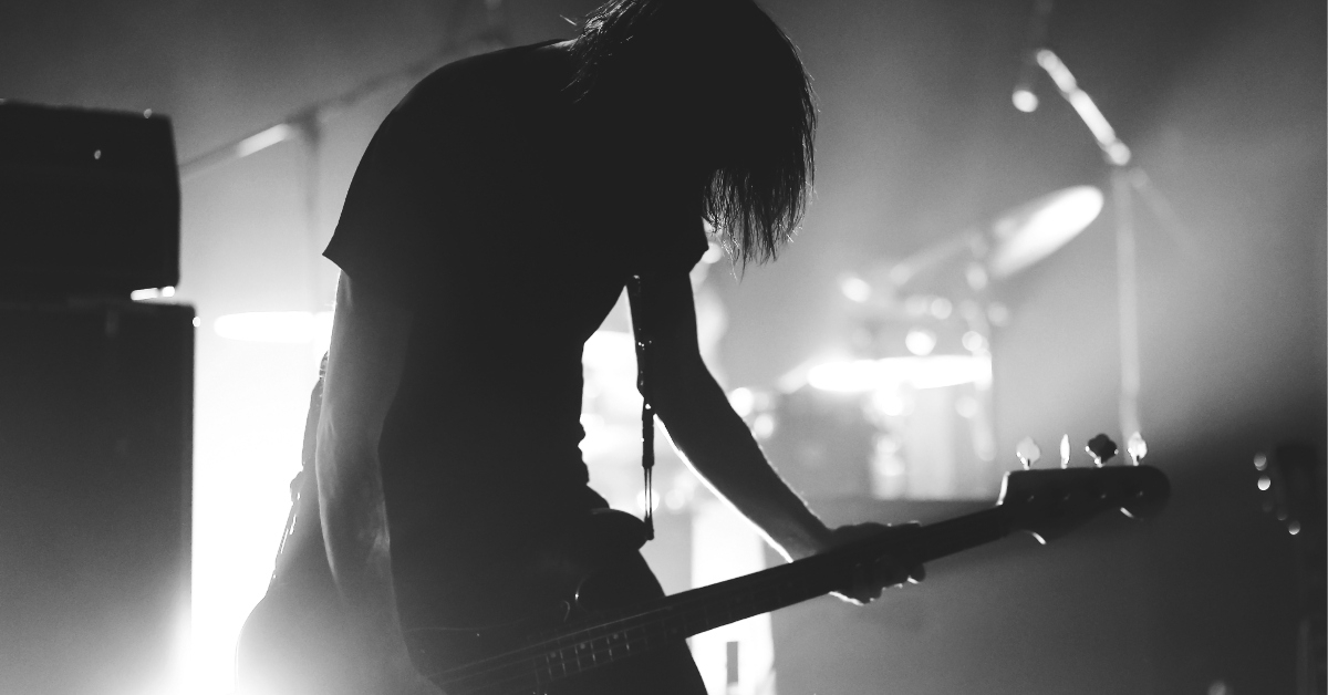 long hair bass guitarist