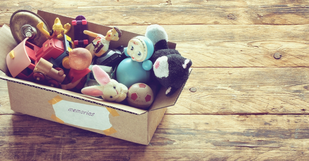 cardboard box with old dusty toys
