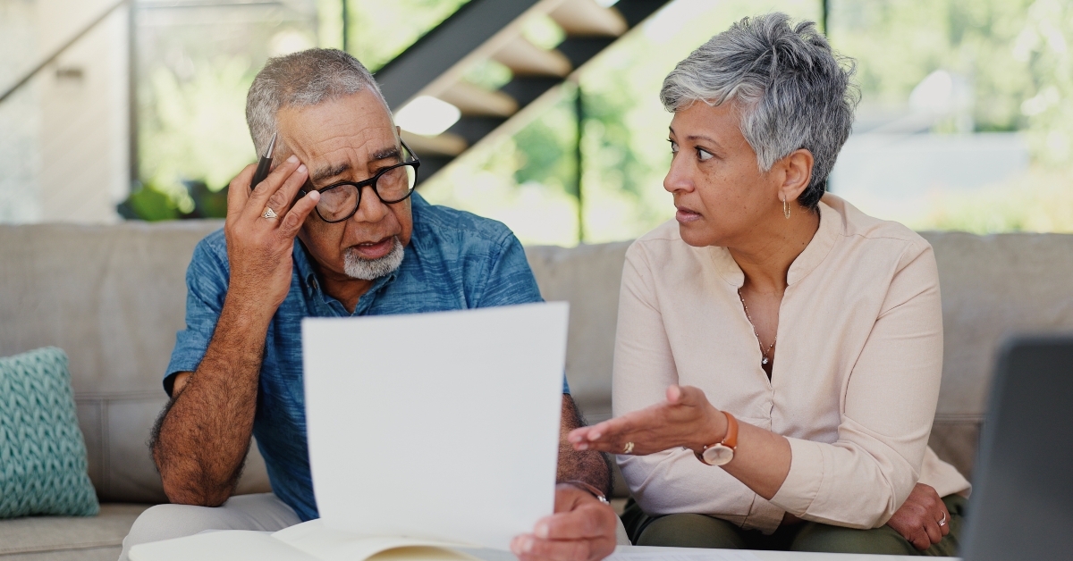 senior couple having discussion for debt