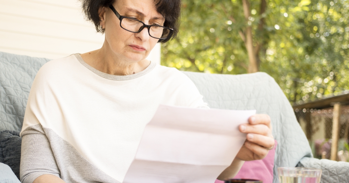 senior woman frustrated by the recieved bad notice