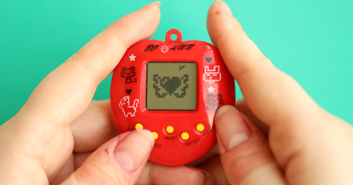 tamagotchi in red plastic case