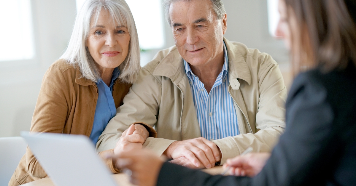 senior couple meeting financial adviser for investment