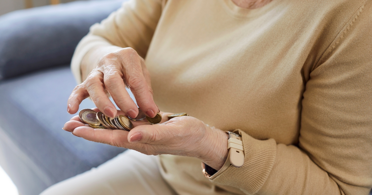 Elderly person holding money