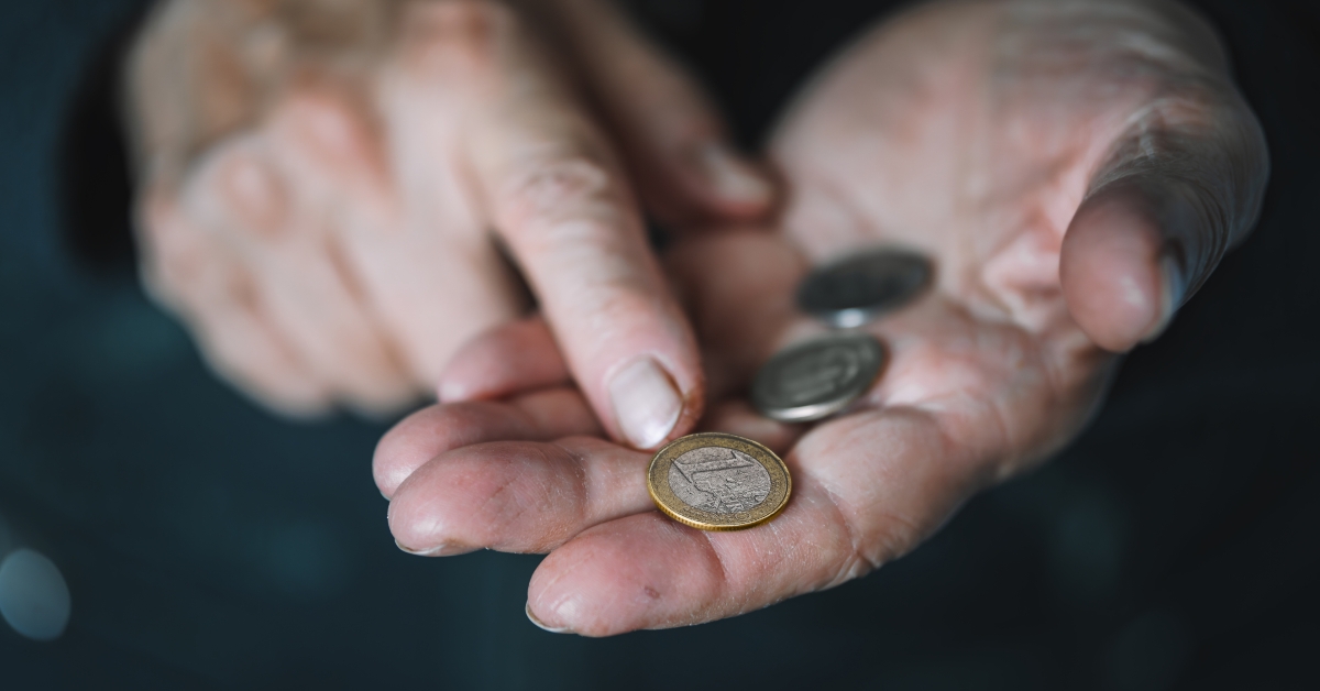 old women's hands count coins