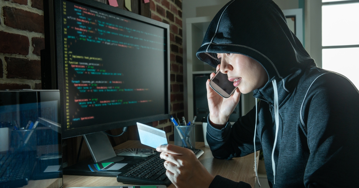 female hacker doing phone fraud